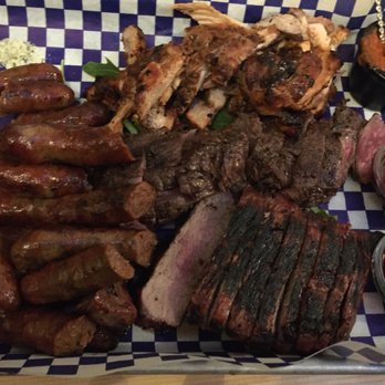 Ciudad - Merguez (beef and lamb sausage), cider brined pork shoulder, herb marinated hangar steak, and harissa marinated chicken - Tapas/Small Plates Near Me - Seattle, Washington