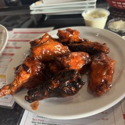 Barbecue wings charred on the grill