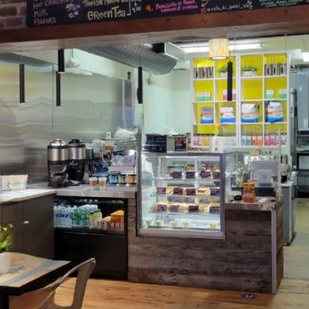 Cafe Du Soleil - 4. We approach the order counter. No one in line. Great! Menu overhead. Sugar and creamer on the left. Exit door is on the right. - Coffee & Tea Near Me - Alexandria, Virginia