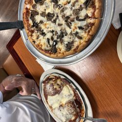 Luigi's Italian Restaurant - Combination Platter, small sausage, onion, mushroom Pizza.