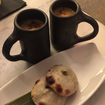 Indian Accent - Starting course, naan with warm melted blue cheese and an accompaniment of soup in a tiny mug. Amazing! - Indian Near Me - New York, New York