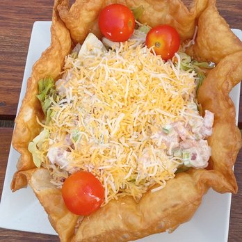 Down the Hatch - There's a shrimp salad on top of a mixed greens salad under all this cheese! - Seafood Near Me - Ponce Inlet, Florida