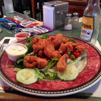 Vinnie's All-Star Bar & Grill - Buffalo chicken tenders over a salad. - Portuguese Near Me - Harrison, New Jersey Vinnie's All-Star Bar & Grill - Buffalo chicken tenders over a salad. - Portuguese Near Me - Harrison, New Jersey