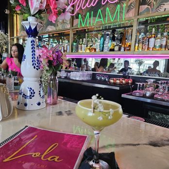 Lola Bar Miami - a cocktail in a martini glass on a table - Cocktail Bars Near Me - Miami, Florida Lola Bar Miami - a cocktail in a martini glass on a table - Cocktail Bars Near Me - Miami, Florida