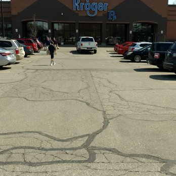 Kroger Food & Pharmacy - a person riding a bike in a parking lot - Grocery Near Me - Orion, Michigan