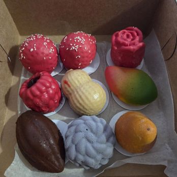 Dar Rafiki’s - Trompe l'oeil pastries. Top left to bottom right: Strawberry, strawberry, rose, raspberry, peanut, mango, cocoa bean, blueberry, and pear. - Bakeries Near Me - Haverhill, Massachusetts