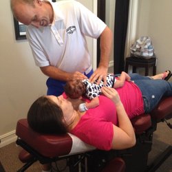 East Cobb Spine & Sport Chiropractic - Adjusting baby on mom's stomach is an easy way to