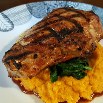 Archie's Tap & Table - Pork chop with sweet potatoes and kale - New American Near Me - Bronx, New York Archie's Tap & Table - Pork chop with sweet potatoes and kale - New American Near Me - Bronx, New York