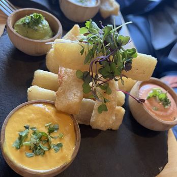 Llama Restaurant - Fried potatoes on the house. Amazing sauces to complement the flavors - Peruvian Near Me - Saint Augustine, Florida