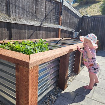 True Landscape - Baby appreciates the planter box for her strawberries! - Landscaping Near Me True Landscape - Baby appreciates the planter box for her strawberries! - Landscaping Near Me