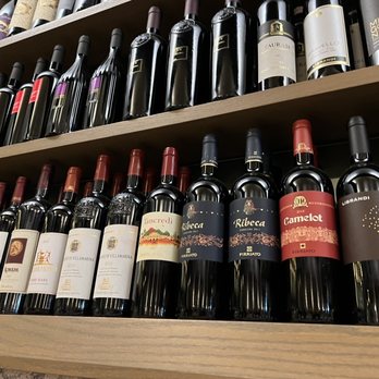 Acqua Pazza - Some of the multiple wine bottles on shelves around the restaurant - Italian Near Me - Milan, Michigan