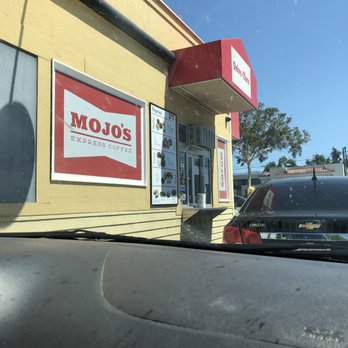 Mojo's Drive Thru Coffee - Drive thru view of the shop. It has a drive-thru window on two sides of the building. - Coffee & Tea Near Me - Corona, California Mojo's Drive Thru Coffee - Drive thru view of the shop. It has a drive-thru window on two sides of the building. - Coffee & Tea Near Me - Corona, California