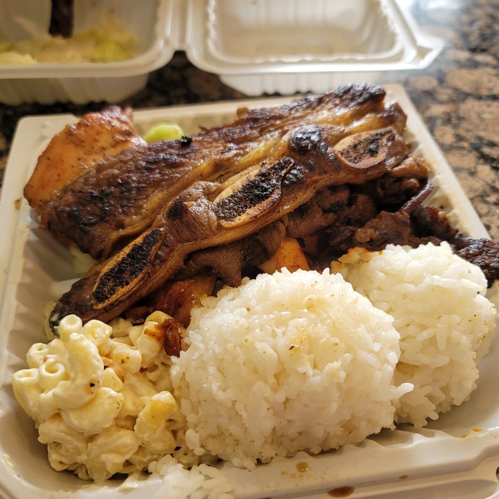 Combination BBQ Meat BBQ Chicken, BBQ Beef and Galbi Short Ribs with Macaroni Salad and a couple scoops of rice Combination BBQ Meat BBQ Chicken, BBQ Beef and Galbi Short Ribs with Macaroni Salad and a couple scoops of rice