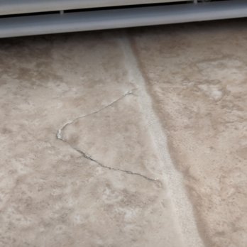 Bonded - Rip from moving the fridge to many times. Tried to hide it by gluing it back down. It's right in front of the fridge and highly noticeable - Flooring Near Me - San Diego, California Bonded - Rip from moving the fridge to many times. Tried to hide it by gluing it back down. It's right in front of the fridge and highly noticeable - Flooring Near Me - San Diego, California