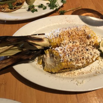 Nuestra Cocina - ELOTE ASADO CON CHILE LIMON Y QUESO (Grilled corn on the cob with chile powder, lime & cotija cheese) - Mexican Near Me - Portland, Oregon Nuestra Cocina - ELOTE ASADO CON CHILE LIMON Y QUESO (Grilled corn on the cob with chile powder, lime & cotija cheese) - Mexican Near Me - Portland, Oregon