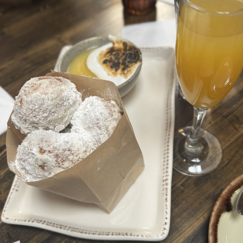 Bosscat Kitchen & Libations - Beignets w/marshmallow lemon curd dip...decadent! - Bars Near Me - Orange, California Bosscat Kitchen & Libations - Beignets w/marshmallow lemon curd dip...decadent! - Bars Near Me - Orange, California