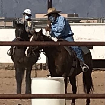 KOLI Equestrian Center - Guiding her horse through the barrels - Venues & Event Spaces Near Me - Phoenix, Arizona