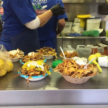 Circleville Pumpkin Show - I was just in awe of the sizes of these stacked/smothered fries. Look at the lemons for scale. - Festivals Near Me - Circleville, Ohio