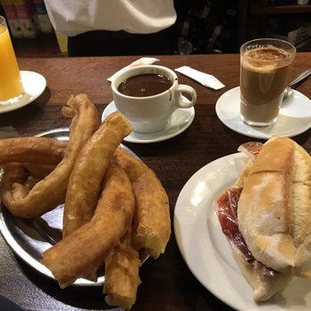 El Comercio - The breakfast spread - churros con chocolate, orange juice, cafe con leche, and a jamon and cheese sandwich for good measure. - Tapas Bars Near Me - Seville, SE El Comercio - The breakfast spread - churros con chocolate, orange juice, cafe con leche, and a jamon and cheese sandwich for good measure. - Tapas Bars Near Me - Seville, SE