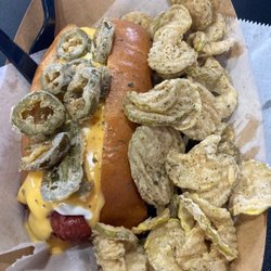 The Dogfather II - Called the Pop it like it's hot.... Bacon wrapped beef dog, Queso,Creamcheese, Fried jalapeños. Side of fried pickles.