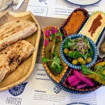 Hamsa - Mezze with muhammara, hummus with harissa, and labneh balls with za'atar - Middle Eastern Near Me - Kraków, Massachusetts