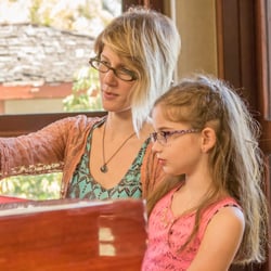 Meghan McKown Music - Meghan teaching a piano lesson with 8 yr. old Audrey K.