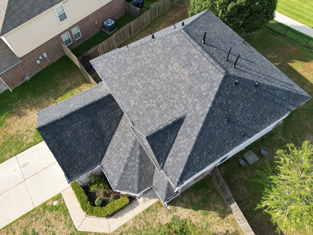 Slide of Shingle Hut Complete Roofing Services