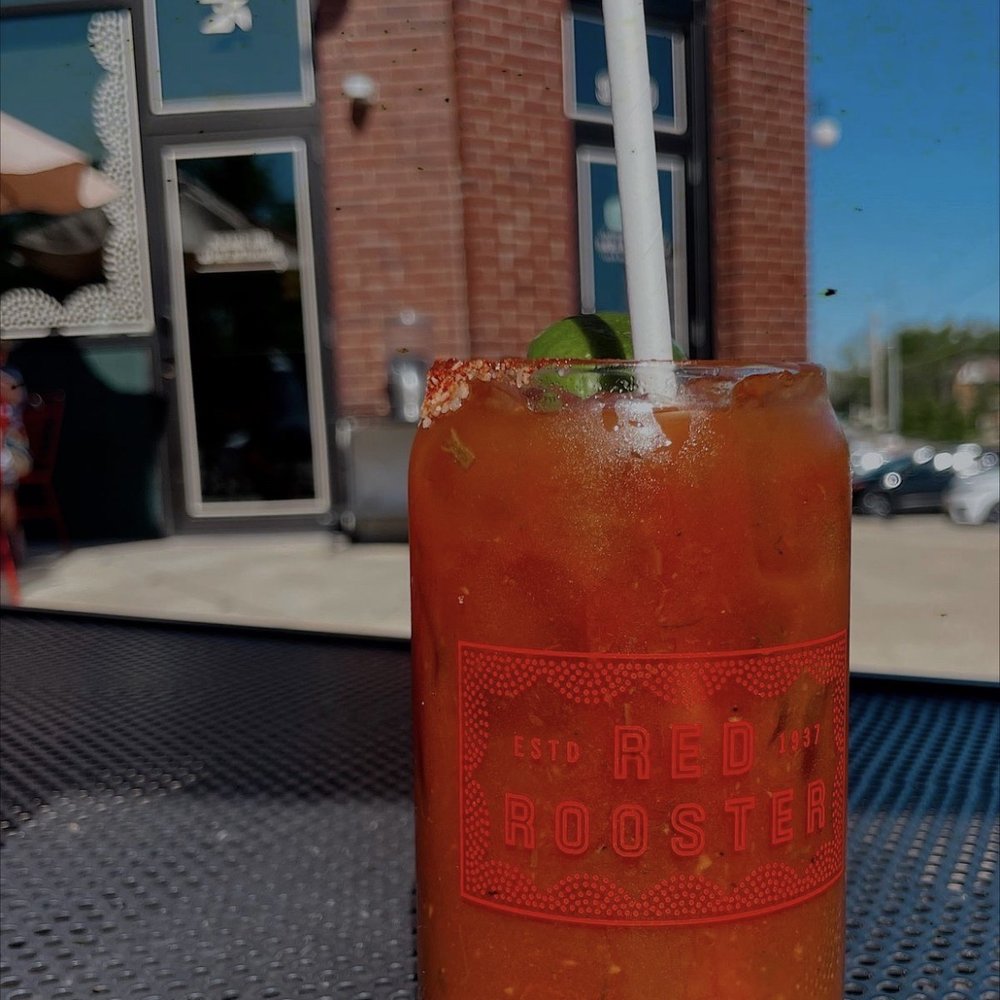 Red Rooster - a drink on a table outside - New American Near Me - Oklahoma City, Oklahoma Red Rooster - a drink on a table outside - New American Near Me - Oklahoma City, Oklahoma