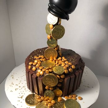 Baker's Trading Sweets Co. - a chocolate cake topped with gold coins - Bakeries Near Me - Bellmore, New York