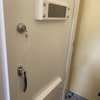 EF5 Tornado Shelters - Outside door is thick and well constructed with ventilation on bottom and window above. - General Contractors Near Me - Edmond, Oklahoma