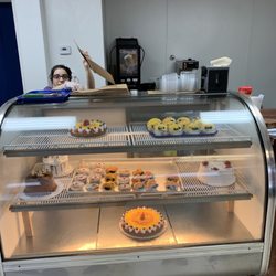 Daisy’s Bakery - This lovely lady... and a case of the prettiest pies and tarts I've ever seen...
