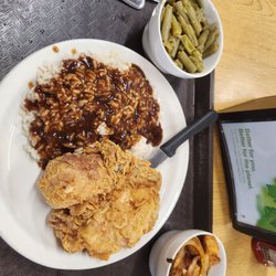 Rockin A Cafe - Fried pork chop, rice brown gravy, green beans taters with onions