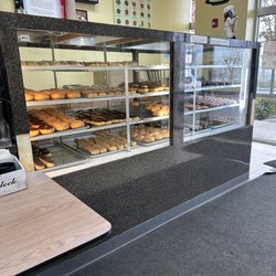 Henry's Donuts - Menu & donut case in the afternoon (filled with fresh donuts)
