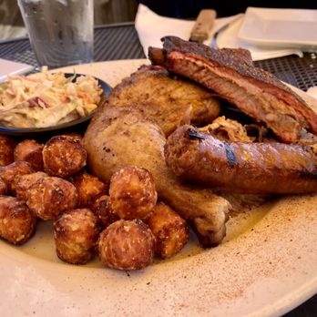 Haze Smokehouse - Sampler - brisket hidden from view, pulled pork peeking out behind link - Barbeque Near Me - Lasalle, Illinois Haze Smokehouse - Sampler - brisket hidden from view, pulled pork peeking out behind link - Barbeque Near Me - Lasalle, Illinois
