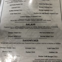 Porter Island Seafood Restaurant - Page 1 of the menu. That's a Cheeseburger in the bottom left corner where the light glares.