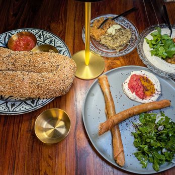 TLV Tapas Bar - JERUSALEM BAGAL (L); ZAALUK (Eggplant); HAMMUS MSABBAHA; and SHORT RIB SIGAR - Mediterranean Near Me - Los Angeles, California TLV Tapas Bar - JERUSALEM BAGAL (L); ZAALUK (Eggplant); HAMMUS MSABBAHA; and SHORT RIB SIGAR - Mediterranean Near Me - Los Angeles, California