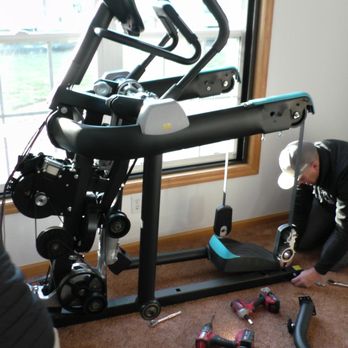Exercise Equipment Installation - The team disassembling equipment. - Fitness/Exercise Equipment Near Me Exercise Equipment Installation - The team disassembling equipment. - Fitness/Exercise Equipment Near Me