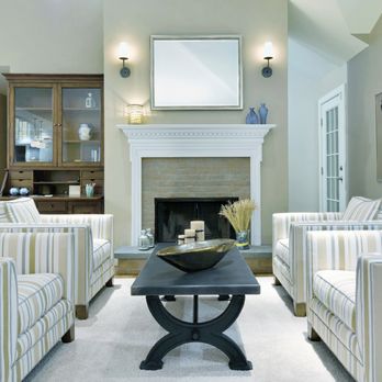 Barbara Feldman Interiors - Transitional Living Room Southampton NY with striped chairs as seating group, metal dining table and fireplace - Interior Design Near Me - East Hampton, New York Barbara Feldman Interiors - Transitional Living Room Southampton NY with striped chairs as seating group, metal dining table and fireplace - Interior Design Near Me - East Hampton, New York