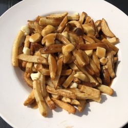 Mulligan’s On Main - Poutine. Real cheese curds. Thicker fries. Gravy a little salty but good.