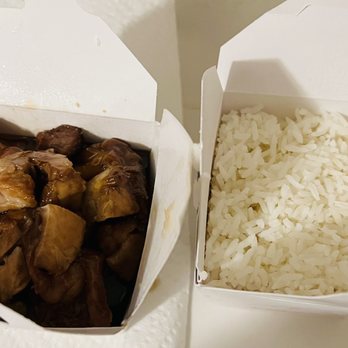 Asian Cafe Express - Teriyaki chicken - Two takeout containers from Asian Cafe Express in Mesa, AZ, hold teriyaki chicken and steamed white rice, served in white paper boxes. - Chinese Near Me - Mesa, Arizona
