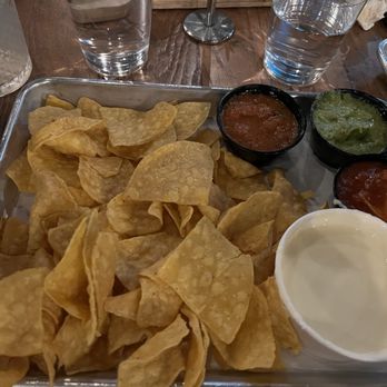Desperados Cantina - Chips w queso & left to right arbol, avocado salsa & table salsa. The shining star in a sea of darkness. - Tacos Near Me - Lexington, Kentucky Desperados Cantina - Chips w queso & left to right arbol, avocado salsa & table salsa. The shining star in a sea of darkness. - Tacos Near Me - Lexington, Kentucky