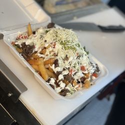 La Tia Angelina - Asada fríes topped with cheese pico sour cream and guacamole