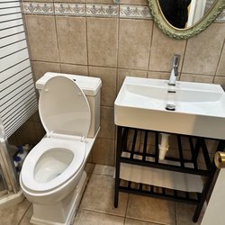 Maximum Plumbing - New toilet, faucet, sink and stand.