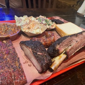 Terry Black's Barbecue - Pork Ribs (front left)
Turkey (middle)
Sausage (middle)
Beef rib (front right)
Burnt ends (back right) - Barbeque Near Me - Austin, Texas Terry Black's Barbecue - Pork Ribs (front left)
Turkey (middle)
Sausage (middle)
Beef rib (front right)
Burnt ends (back right) - Barbeque Near Me - Austin, Texas