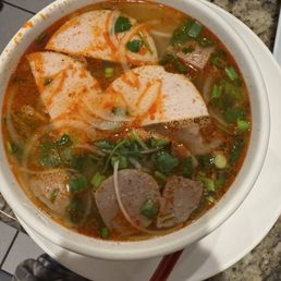 B5. Bún Bò Huế- Thick vermicelli noodle in beef, spicy hue style with beef brisket, and Vietnamese ham and beef meatball B5. Bún Bò Huế- Thick vermicelli noodle in beef, spicy hue style with beef brisket, and Vietnamese ham and beef meatball