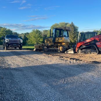 Rycoe Enterprises - a tractor and bulldozer on a dirt road - Landscaping Near Me - Auburn, New York Rycoe Enterprises - a tractor and bulldozer on a dirt road - Landscaping Near Me - Auburn, New York