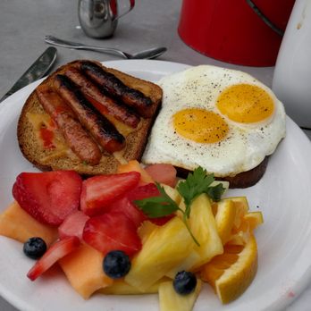Both Ways Cafe & Catering - Made to order fried egg sandwich with chicken sausage on top and fruit substituted for potatoes. Very tasty. - Breakfast & Brunch Near Me - Seattle, Washington