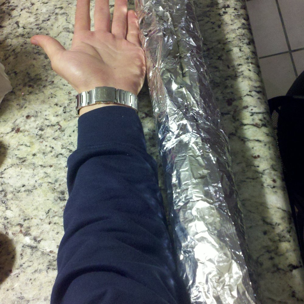 Plaza Garibaldi - a person holding a sandwich wrapped in foil - Street Vendors Near Me - San Pablo, California Plaza Garibaldi - a person holding a sandwich wrapped in foil - Street Vendors Near Me - San Pablo, California