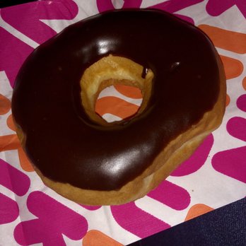 Dunkin' -  a chocolate frosted donut on a napkin - Donuts Near Me - Tampa, Florida