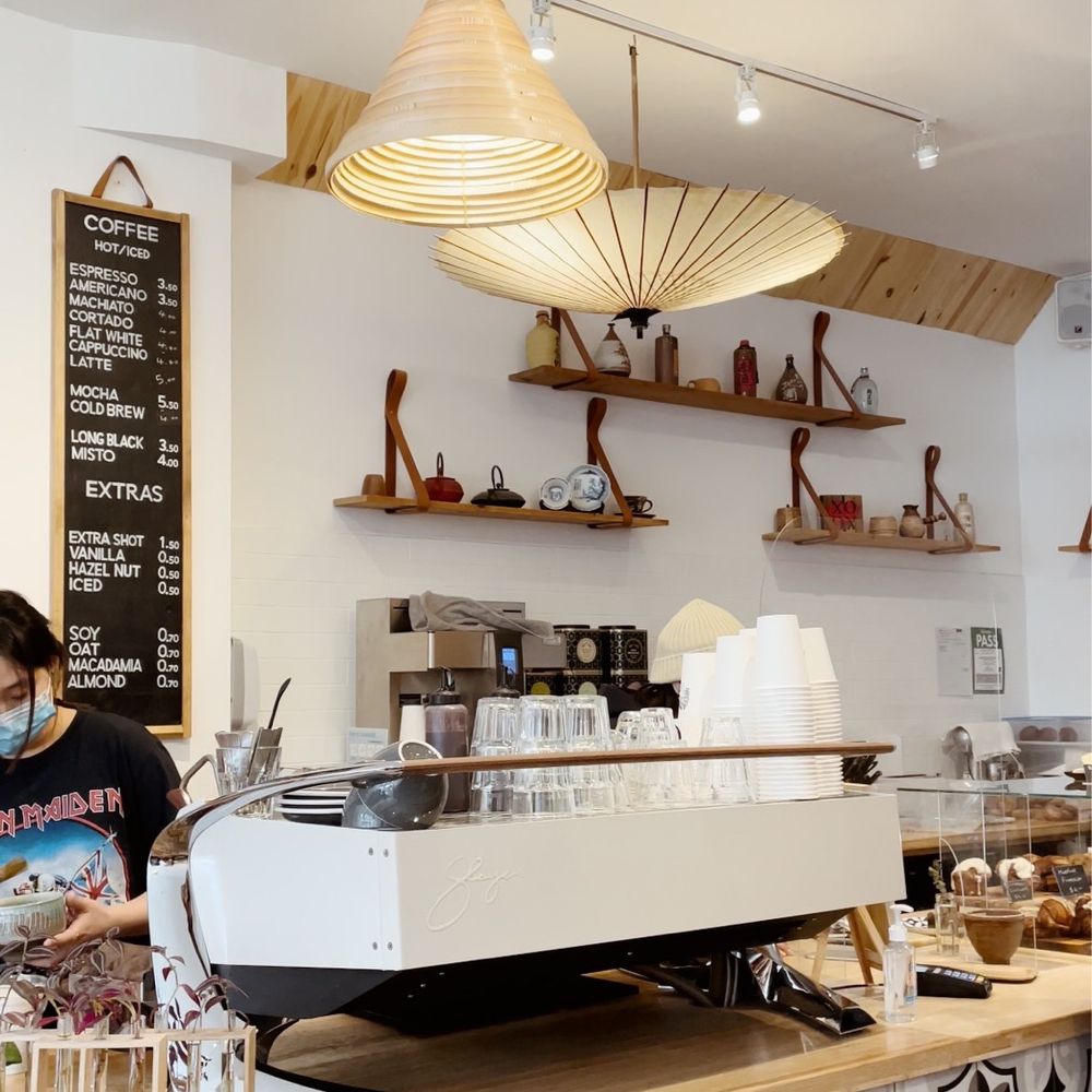 Ninetails Coffee Bar - a woman working behind the counter - Coffee & Tea Near Me - Toronto, Ontario Ninetails Coffee Bar - a woman working behind the counter - Coffee & Tea Near Me - Toronto, Ontario